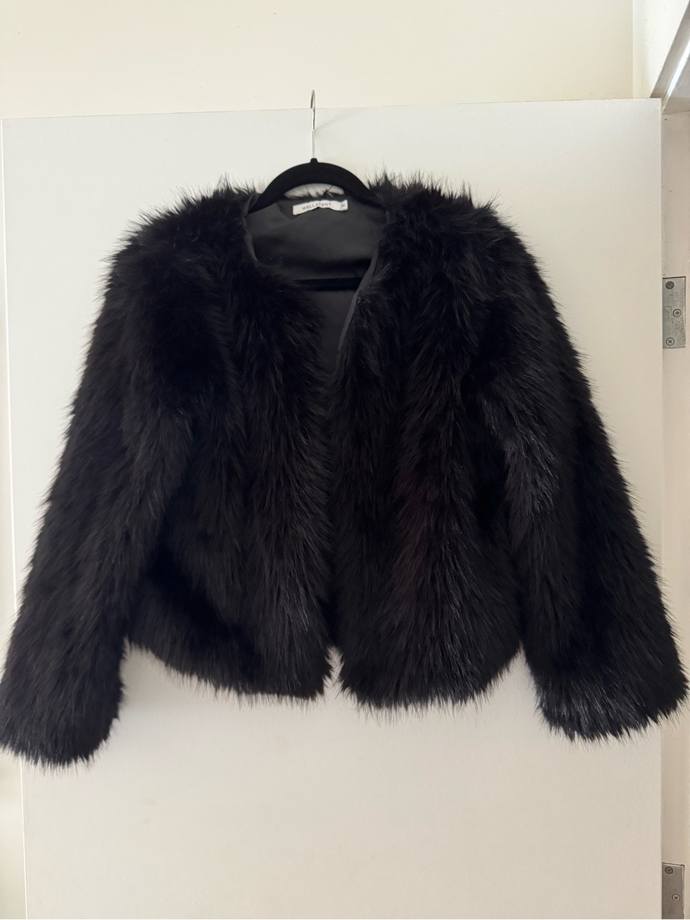 Black faux fur jacket. NWOT. Lined. Pockets. Size S. Versatile